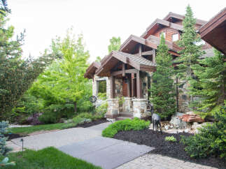 This stunning property boasts a beautiful stone facade and a welcoming entrance.