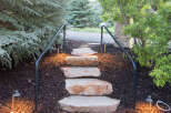 This property features a charming stone pathway leading up to the entrance, creating a welcoming ambiance.