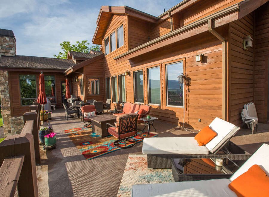 Enjoy the stunning views from this luxurious wooden house with a spacious patio.