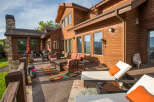 Enjoy the stunning views from this luxurious wooden house with a spacious patio.