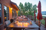 Enjoy the perfect evening on this stunning deck, complete with a cozy fire pit table.