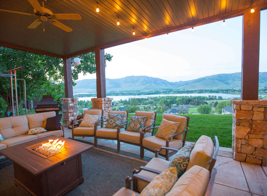 Enjoy the stunning views from this outdoor patio, complete with a cozy fire pit and comfortable seating.