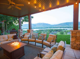 Enjoy the stunning views from this outdoor patio, complete with a cozy fire pit and comfortable seating.