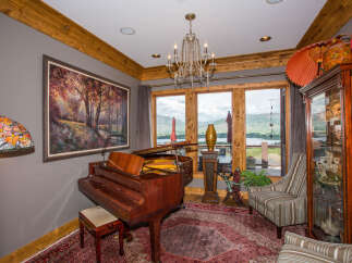 This stunning living space features a grand piano, perfect for musical enjoyment.