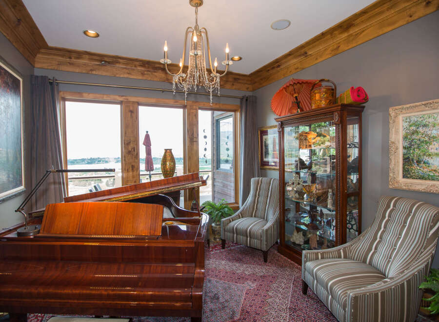 Elegant living space featuring a grand piano, perfect for music enthusiasts.