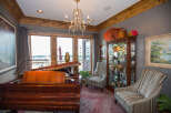 Elegant living space featuring a grand piano, perfect for music enthusiasts.