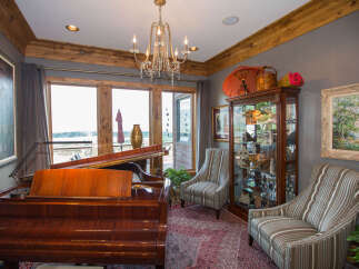 Elegant living space featuring a grand piano, perfect for music enthusiasts.