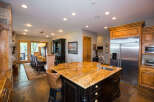 This stunning kitchen boasts a large island with a granite countertop, perfect for meal prep and entertaining.