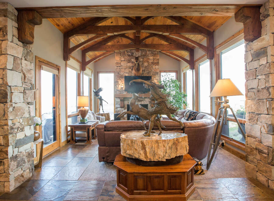 Step into luxury with this stunning property featuring exquisite stone accents and a warm, inviting ambiance.