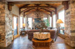 Step into luxury with this stunning property featuring exquisite stone accents and a warm, inviting ambiance.