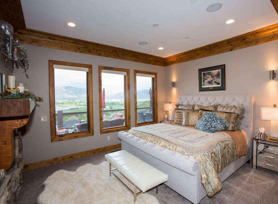 This luxurious bedroom boasts stunning views and elegant design.