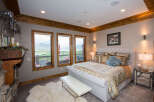 This luxurious bedroom boasts stunning views and elegant design.