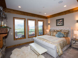 This luxurious bedroom boasts stunning views and elegant design.