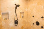 Step into luxury with this stunning bathroom featuring a custom tiled shower.