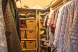 Step into this well-organized walk-in closet, a haven for your wardrobe.