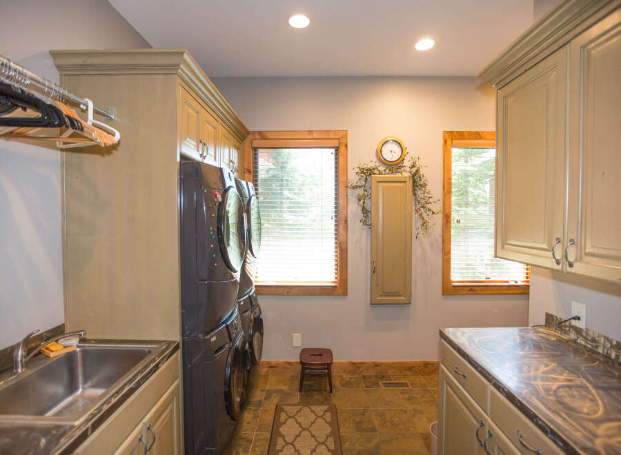 This laundry room boasts a stylish and functional design.