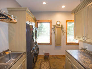 This laundry room boasts a stylish and functional design.