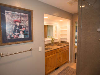 This beautiful bathroom features a stunning framed artwork, adding a touch of elegance to the space.