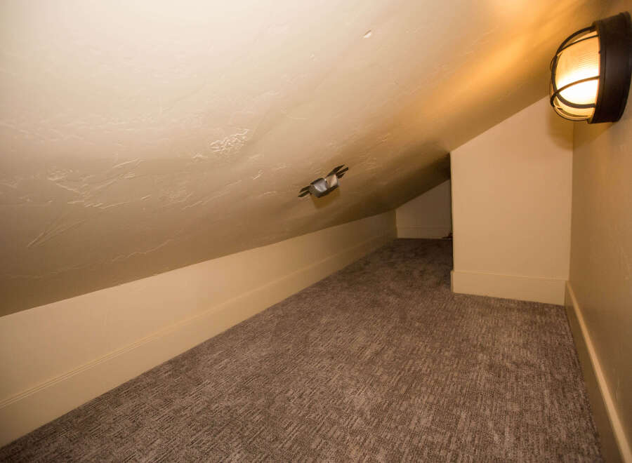 Discover the charm of this cozy attic space, perfect for a unique retreat.