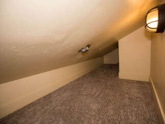 Discover the charm of this cozy attic space, perfect for a unique retreat.