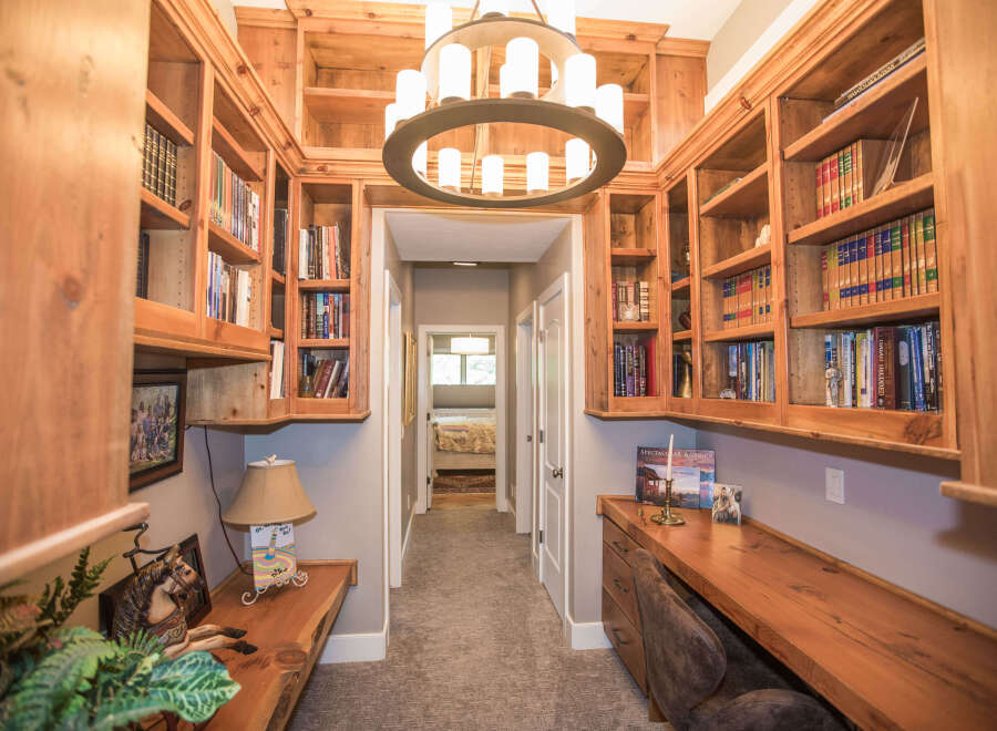 This stunning home office boasts custom built-in bookshelves, perfect for displaying your literary collection.