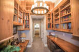 This stunning home office boasts custom built-in bookshelves, perfect for displaying your literary collection.