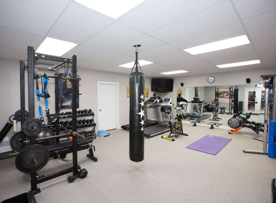 This home gym is fully equipped for a comprehensive workout.