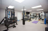 This home gym is fully equipped for a comprehensive workout.