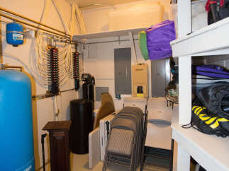 This basement storage area offers ample space for organization.