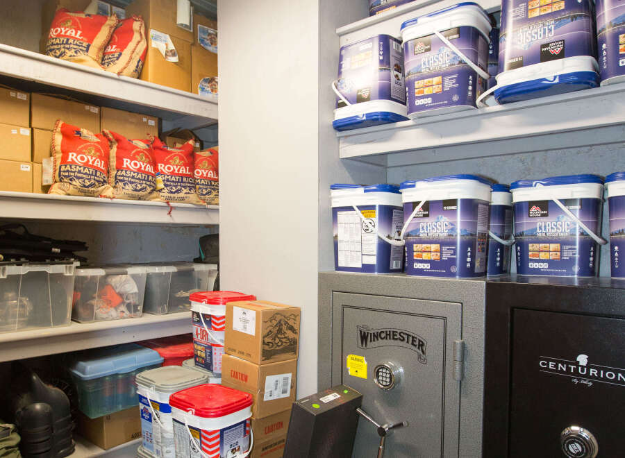 This storage space features a well-organized layout with shelves stocked with various supplies.