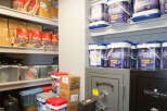 This storage space features a well-organized layout with shelves stocked with various supplies.