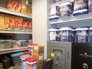 This storage space features a well-organized layout with shelves stocked with various supplies.