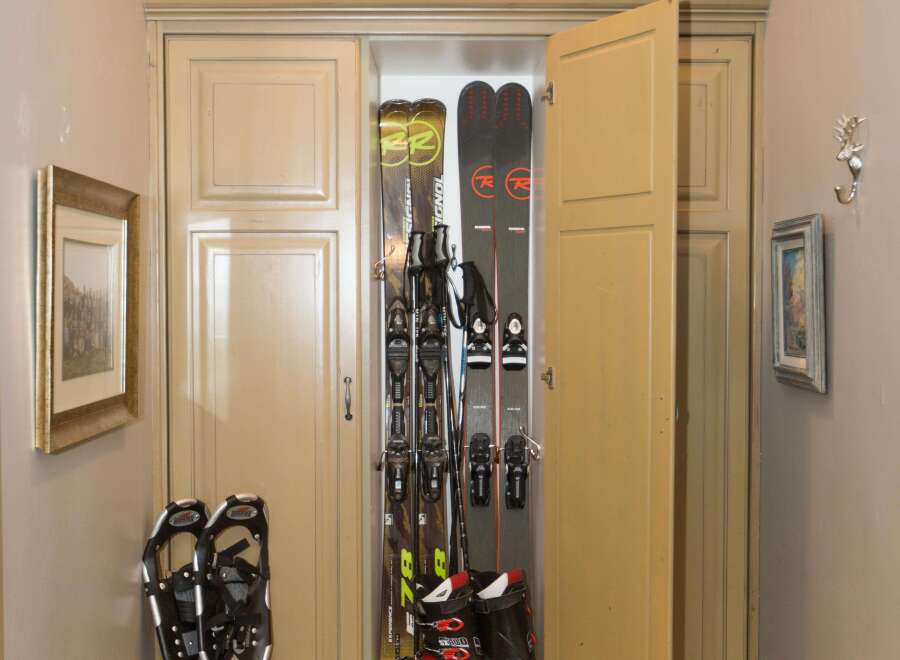 This entryway features a custom ski storage cabinet, perfect for keeping gear organized.