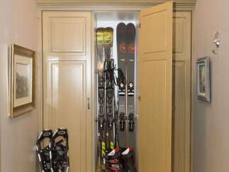 This entryway features a custom ski storage cabinet, perfect for keeping gear organized.
