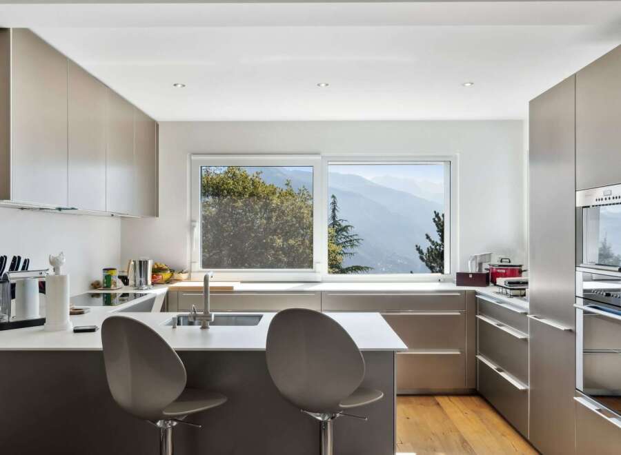 Modern kitchen with stunning mountain views.