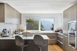 Modern kitchen with stunning mountain views.
