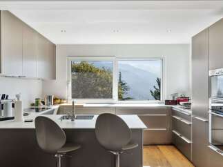 Modern kitchen with stunning mountain views.