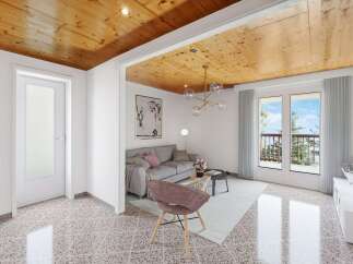 This stunning property boasts a spacious living area with large windows offering breathtaking views, complemented by a unique wooden ceiling and stylish furnishings.