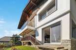 This stunning property boasts a modern design with a spacious balcony offering breathtaking views.