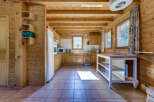 Step into this charming kitchen, featuring warm wooden accents and a cozy atmosphere.