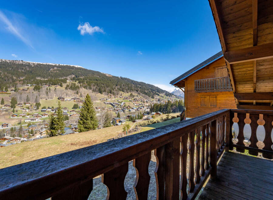 Enjoy breathtaking mountain views from this charming wooden chalet.