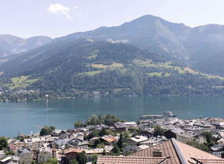 Enjoy breathtaking views of the lake and mountains from this stunning property.