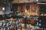 Step into a beautifully designed restaurant with a warm and inviting atmosphere.