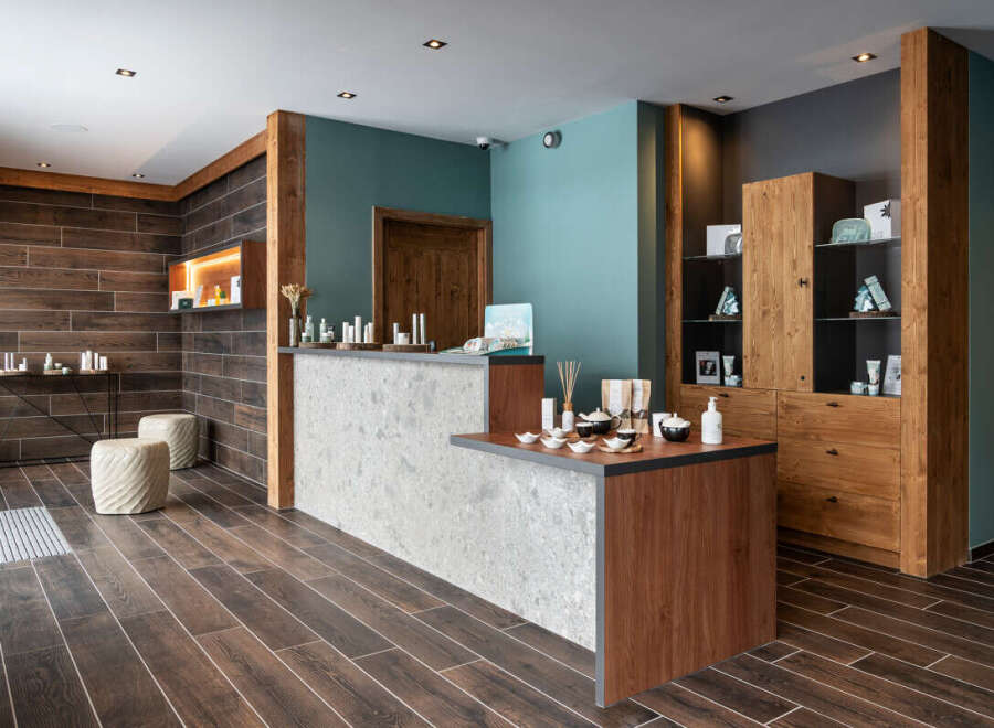 This spa reception boasts a sleek, modern design with a calming color palette.