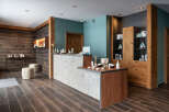 This spa reception boasts a sleek, modern design with a calming color palette.