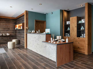 This spa reception boasts a sleek, modern design with a calming color palette.