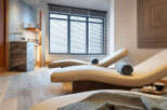 Relax and rejuvenate in our luxurious spa, featuring comfortable chaise lounges perfect for unwinding.