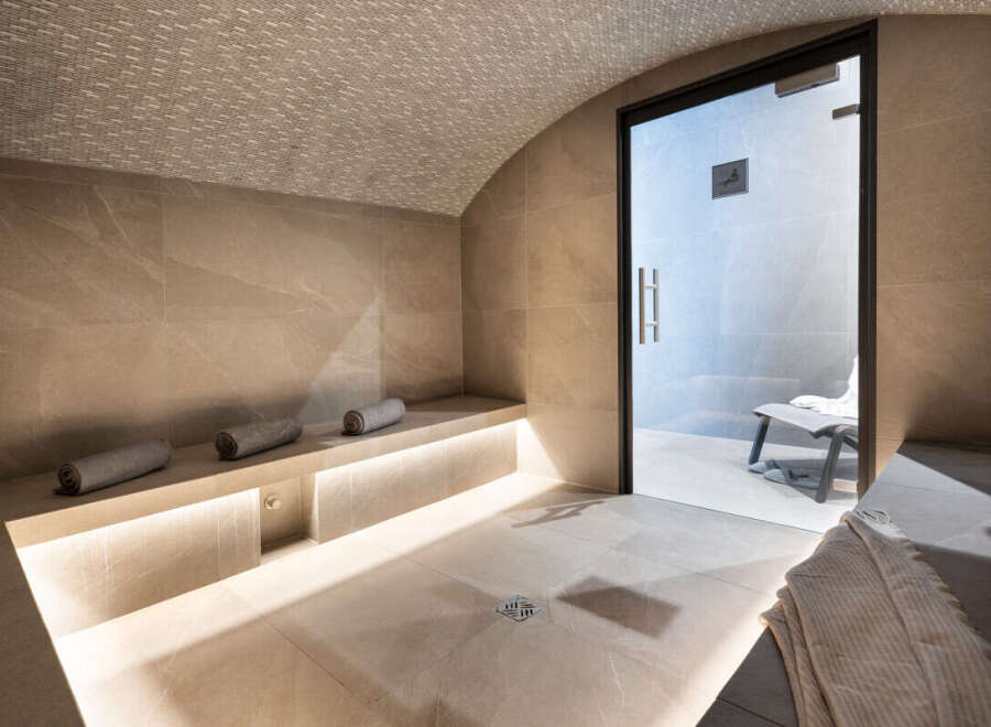 Indulge in tranquility within this luxurious spa, featuring a meticulously designed steam room.