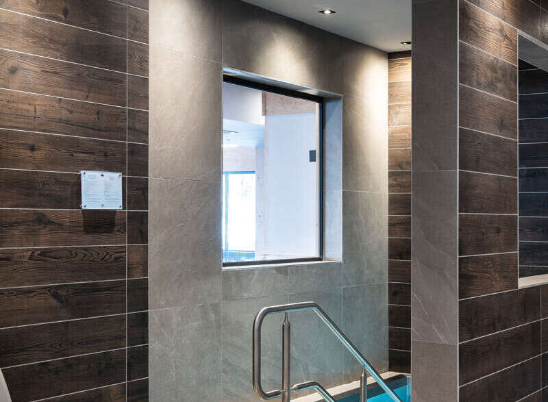 Relax and rejuvenate in our luxurious spa, featuring a tranquil plunge pool surrounded by sleek, modern tiling.