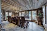 Rustic mountain chalet with a stunning wood-paneled dining room.